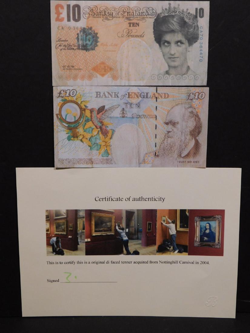 Banksy: Di-Faced Tenners (Ten Pound Notes).: Banksy (British, b. 1974): Two Di-Faced Tenners (Ten Pound Notes) from Nottinghill Carnival (2004). These 2 notes have the following hallmarks: Diana's face replacing the Queen's; 'Banksy of England',