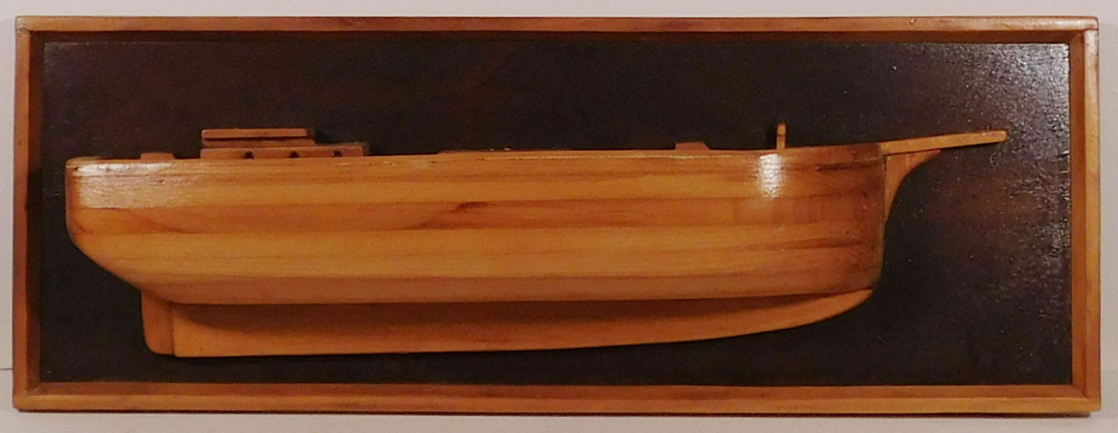 Bim Doughty: Half Hull Ship: Bim Doughty (American, 20th Century): Half Hull Ship. Carved wood ship on wood backing. Made in Orr Island, Maine. 12 L x 35 H x 5 W inches