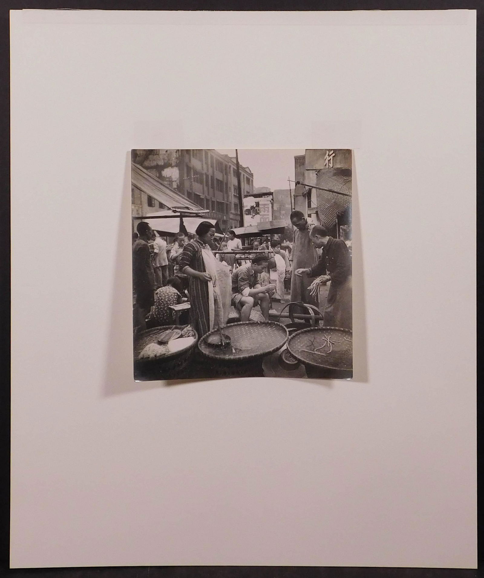 Cecil Beaton: Street Stalls in a Chungking Market, 1945: Cecil Beaton (British, 1904-1980): Street Stalls in a Chungking Market, 1945. Vintage gelatin silver print. Hinged to mat board. Labeled British Official Photograph (Ministry of Information) Crown Cop