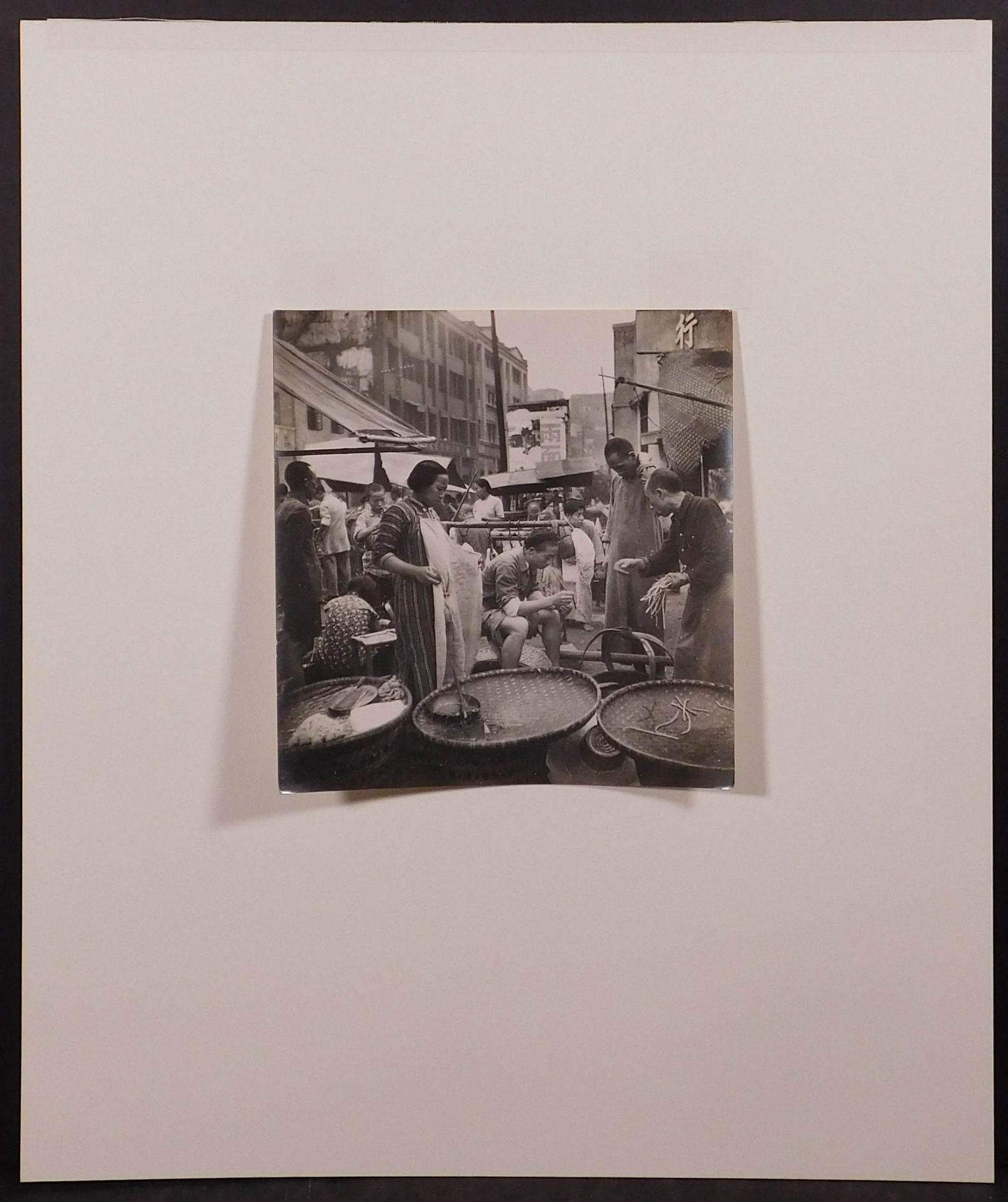 Cecil Beaton: Street Stalls in a Chungking Market, 1945: Cecil Beaton (British, 1904-1980): Street Stalls in a Chungking Market, 1945. Vintage gelatin silver print. Hinged to mat board. Labeled British Official Photograph (Ministry of Information) Crown Cop