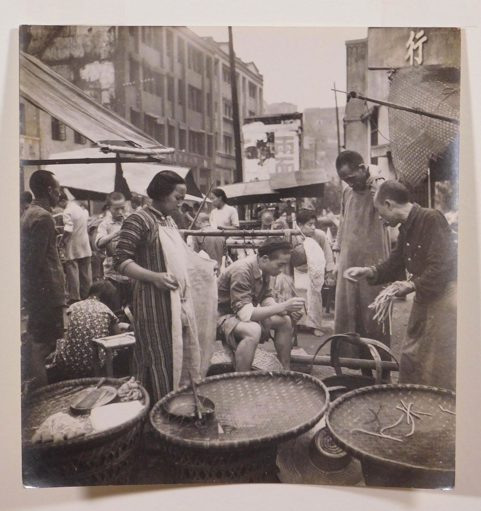 Cecil Beaton: Street Stalls in a Chungking Market, 1945: Cecil Beaton (British, 1904-1980): Street Stalls in a Chungking Market, 1945. Vintage gelatin silver print. Hinged to mat board. Labeled British Official Photograph (Ministry of Information) Crown Cop