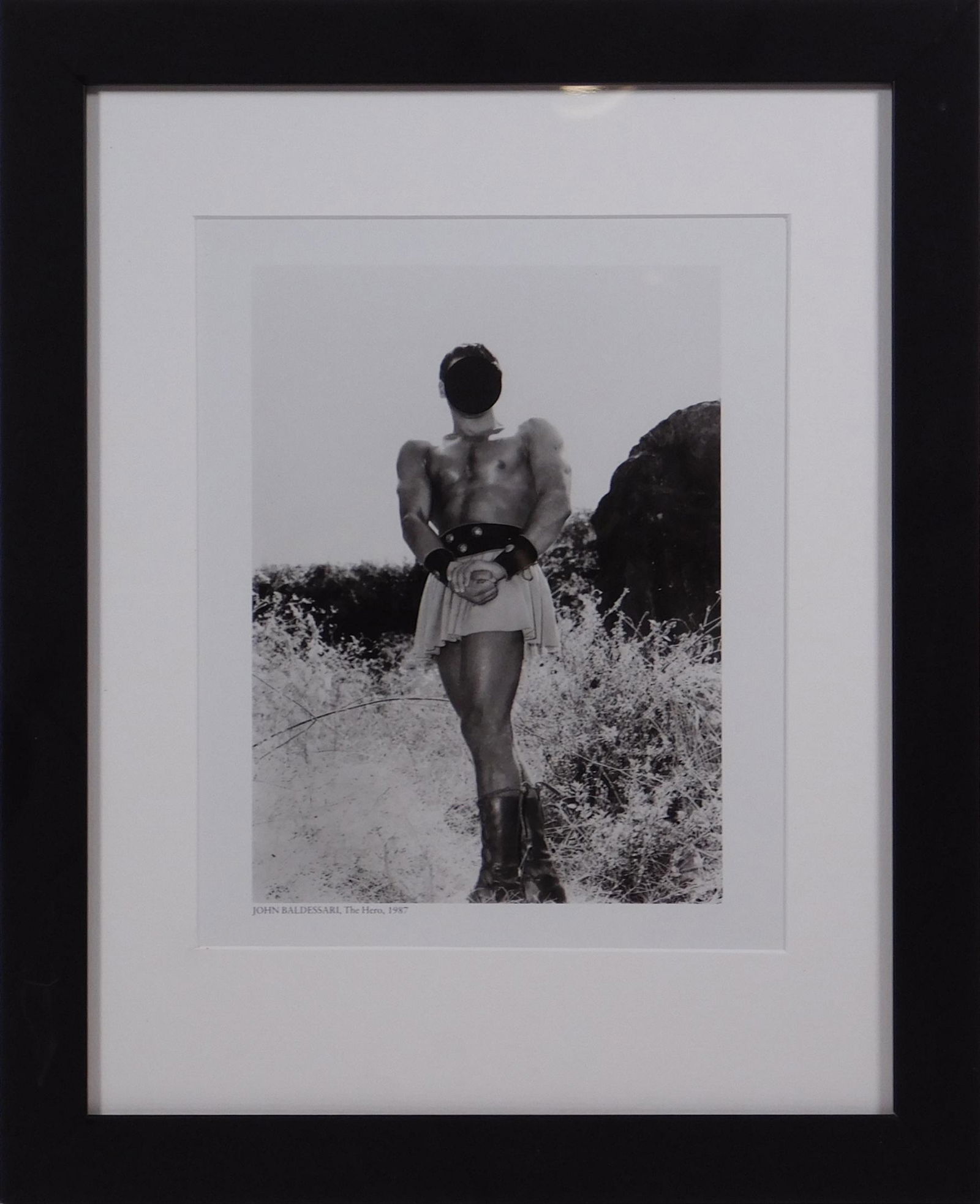 John Baldesarri: The Hero: John Baldesarri (American, 1931-2020): The Hero, 1998. Lithograph, unsigned, professionally framed. John Anthony Baldessari was an American conceptual artist known for his work featuring found photogr