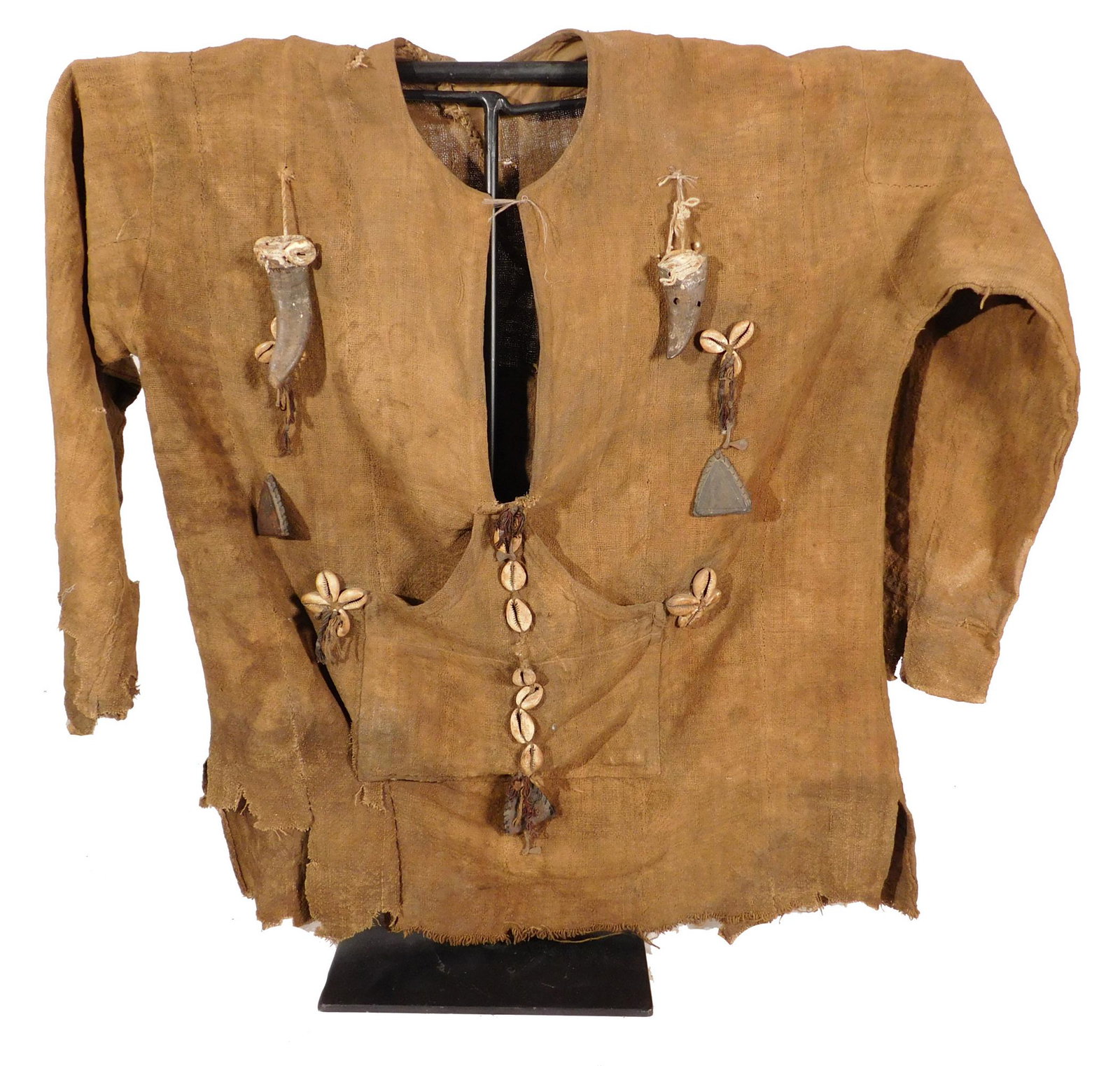 Hunter's Shirt with Amulets, Ibibio People, Nigeria: African Tribal Art: Ibibio People, Nigeria: Hunter's Shirt with Amulets. Rough-woven fiber with attachments of metal, animal teeth and shells. Early/mid 20th century. The shirt comes with a custom-mad