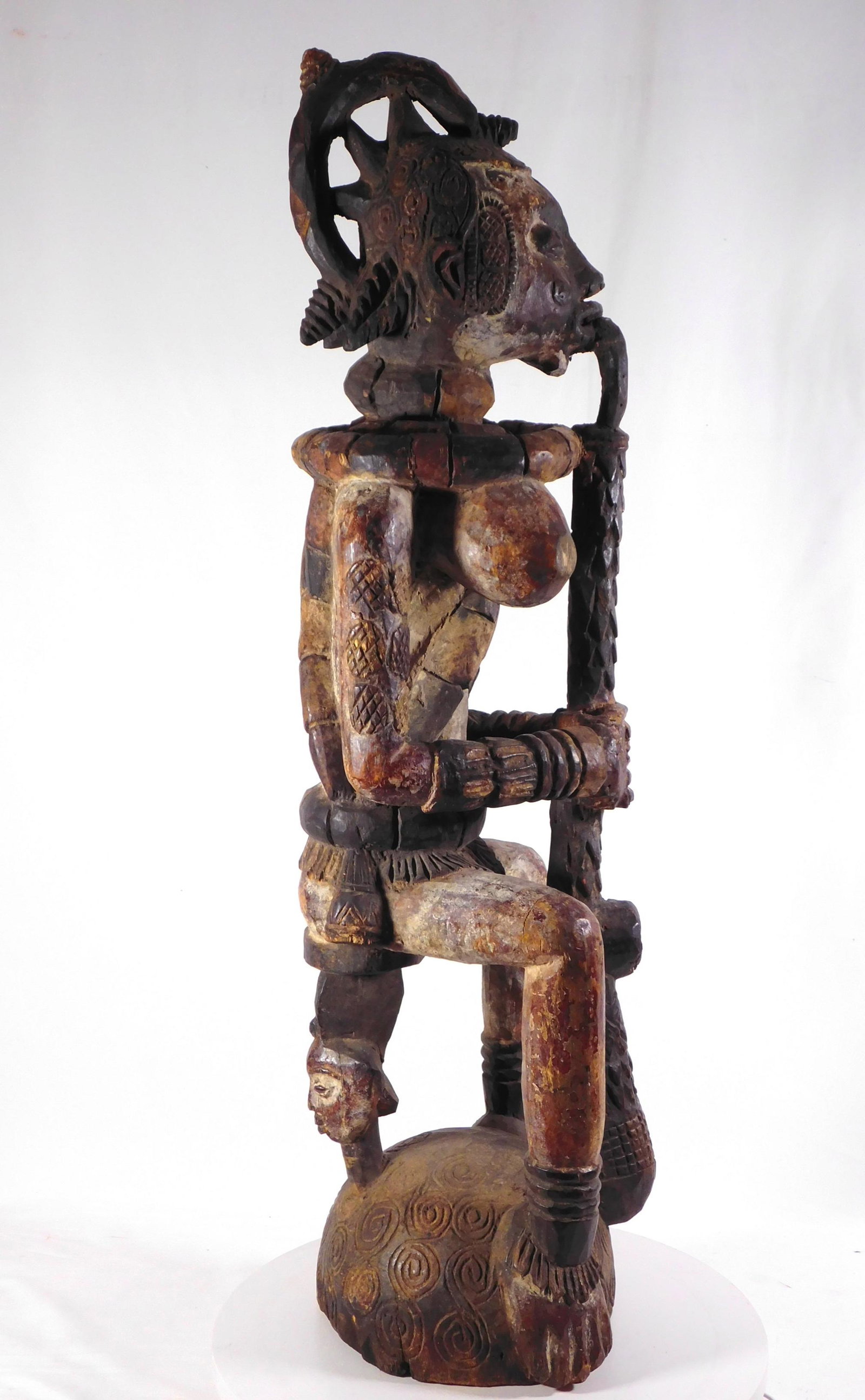 African Tribal: Ebo Nigeria: Woman with Pipe: Ebo People, Nigeria: Figure of a Woman Smoking a Pipe 36H x 10W x 10D (inches). Private Collection