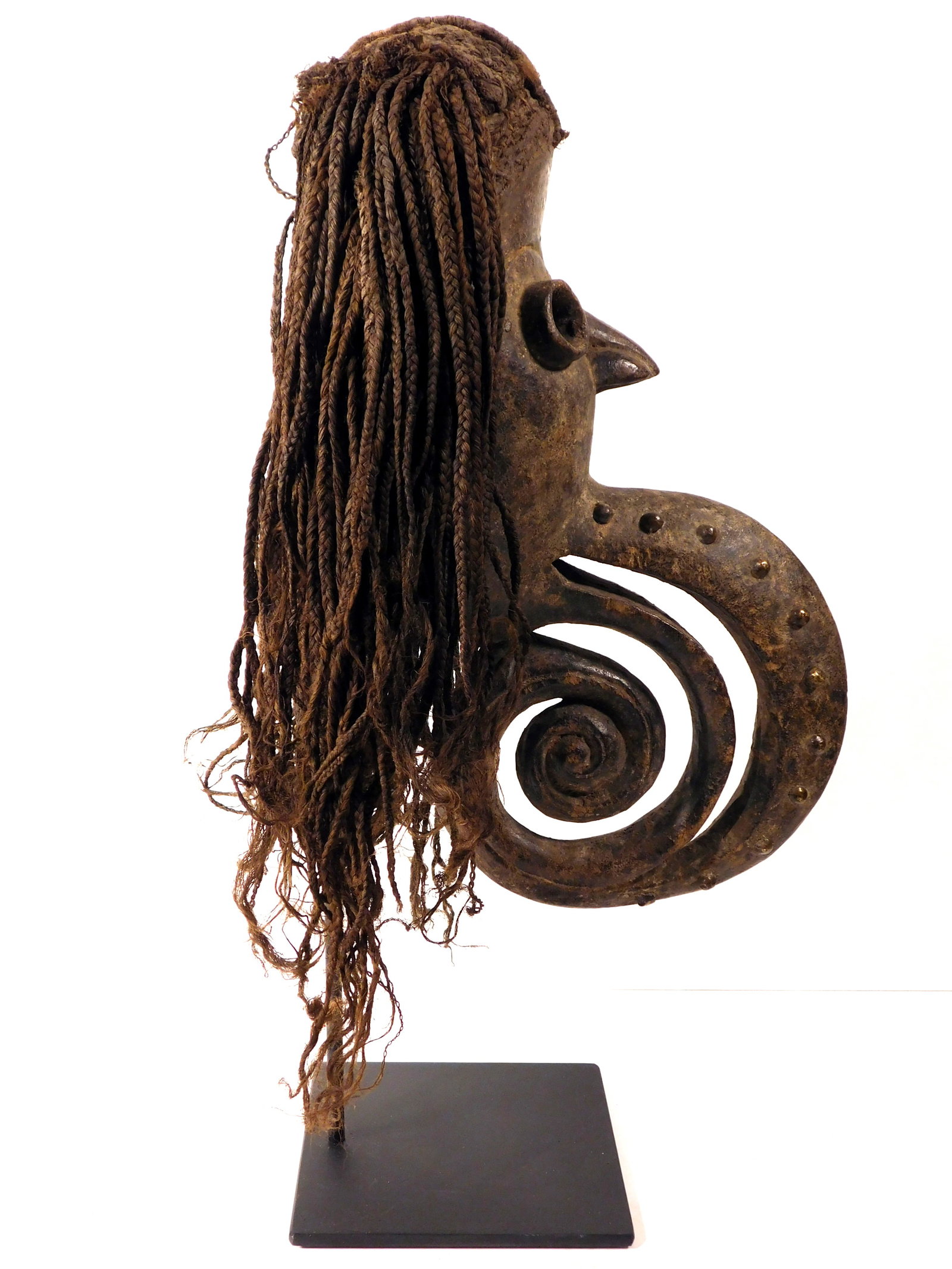 Unusual Bird Mask, Dan People, Liberia: African Tribal Art: Dan People, Liberia: A rare anthropomorphic mask with a combination of human and bird features. Carved wood with elaborately braided fiber hair, the human-like face has a tubular