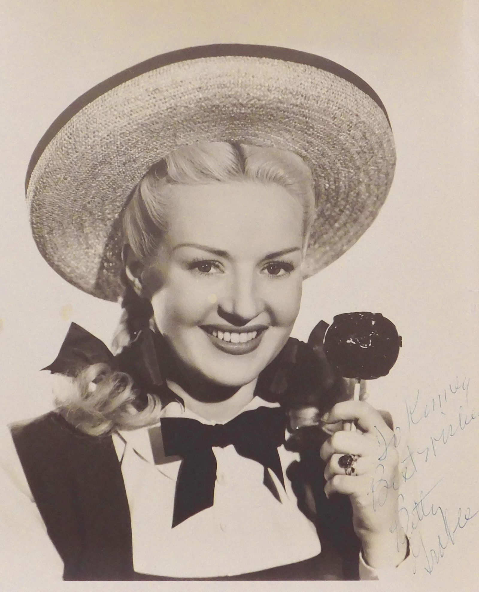 Singed Portrait of Betty Grable: Singed Portrait of Betty Grable from The Dolly Sisters, signed to Kenny in ink lower right, unframed. 9.5 x 8 inches paper. Private collection, Madison, WI, USA. Very good condition; top edge is