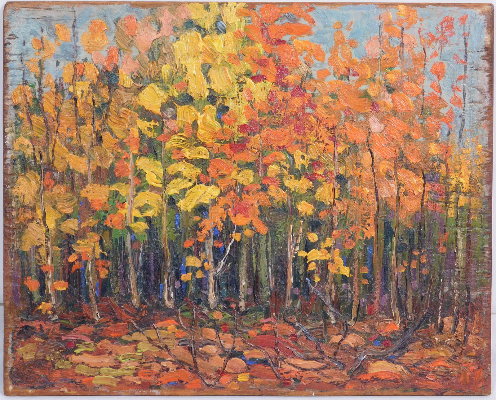 Tom Thomson, Attributed/Manner of: Autumn Algonquin Park: Thomas John "Tom" Thomson (Canadian, 1877-1917) Attributed/Manner of: Autumn Algonquin Park c.1914. Oil on wood panel.Bearing the faint impression of the artist's round logo stamp in the lower left