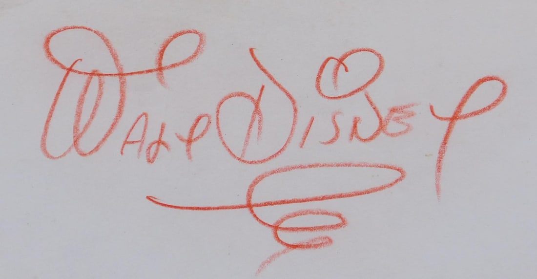 Walt Disney Autograph: Walt Disney (1901-1966) Autograph, Red pencil on paper, unmounted/not framed. Approx. 3 x 6.5 inches. Private collector, New York. Age-toned paper with tape stains from previous mounting. Some