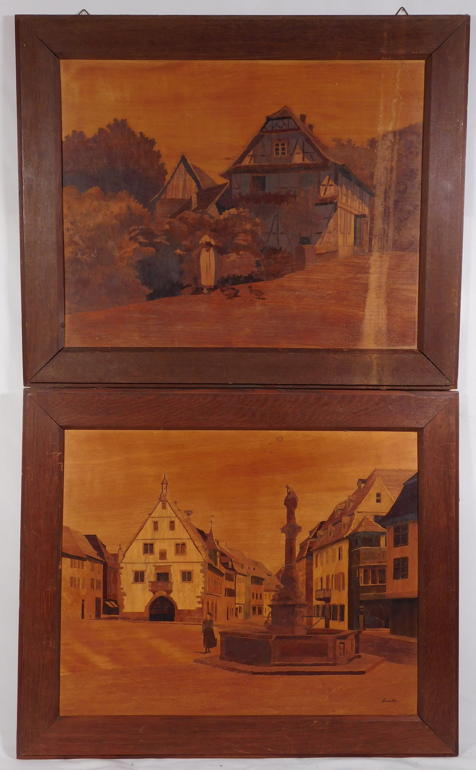 Pair of European Marquetry Town Scenes, Signed: Pair of Marquetry EuropeanTown Scenes, inlaid wood on panels, framed, one Signed indistinctly, c.1940. Overall 20 x 24 inches each. Private collection, Massachusetts, USA. Overall darkeing on the