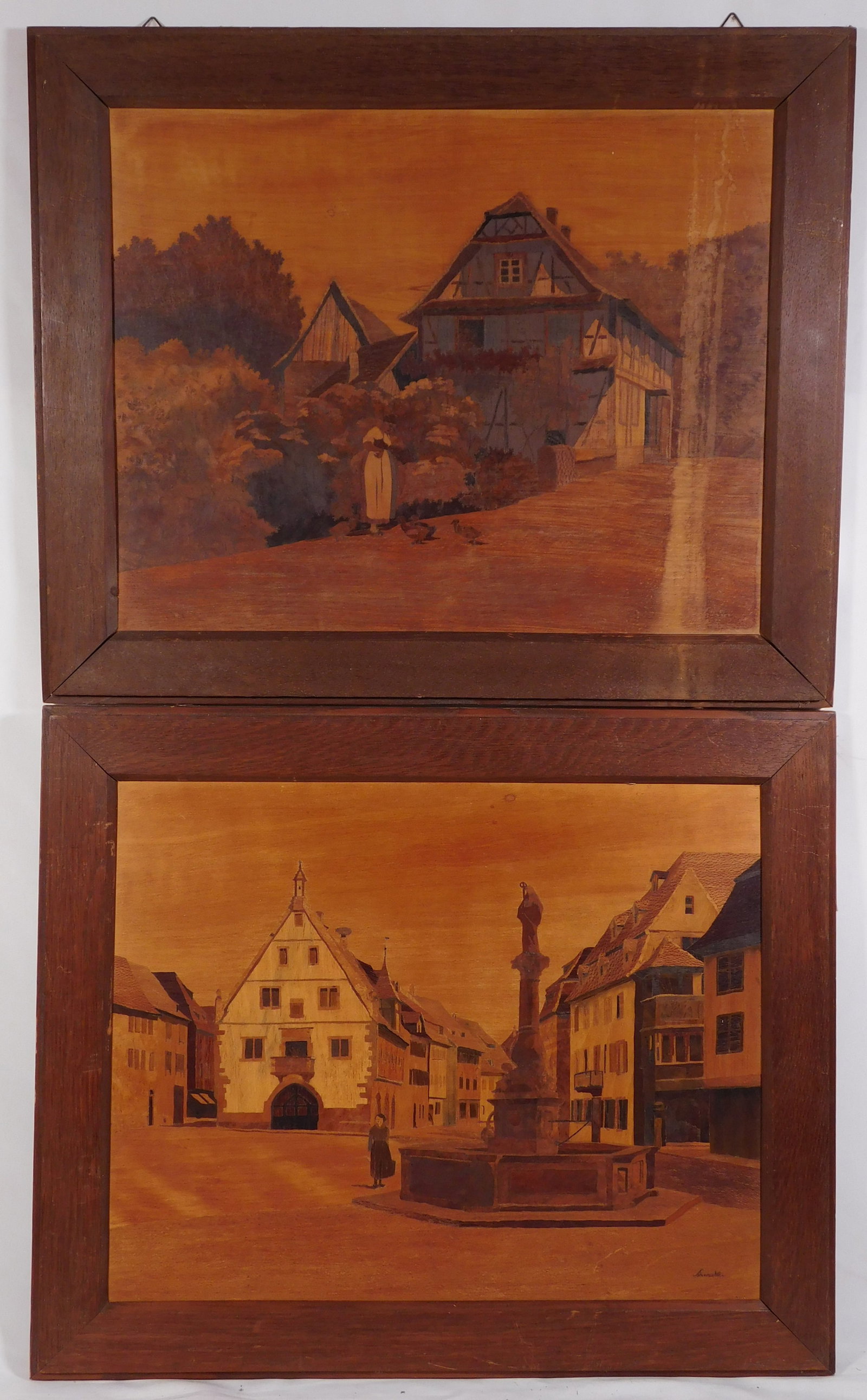 Pair of European Marquetry Town Scenes, Signed: Pair of Marquetry EuropeanTown Scenes, inlaid wood on panels, framed, one Signed indistinctly, c.1940. Overall 20 x 24 inches each. Private collection, Massachusetts, USA. Overall darkeing on the