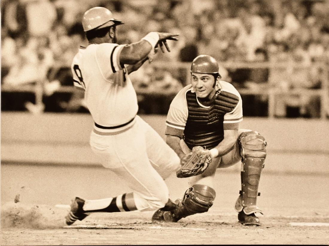 Johnny Bench Canvas - Out at the Plate: An archival photo on canvas entitled Out At The Plate featuring Hall of Famer Johnny Bench, was taken on August 15, 1973. Johnny may be the model against which all future catchers are judged. A star b