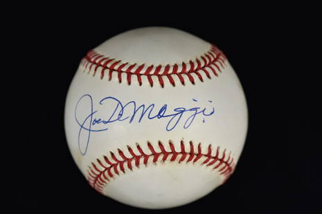 Joe DiMaggio Signed Ball-JSA: A Joe DiMaggio signed baseball. This piece is a Rawlings Official American League baseball and features the signature of renown baseball player Joe DiMaggio in blue ink on the "sweet spot". The ball i