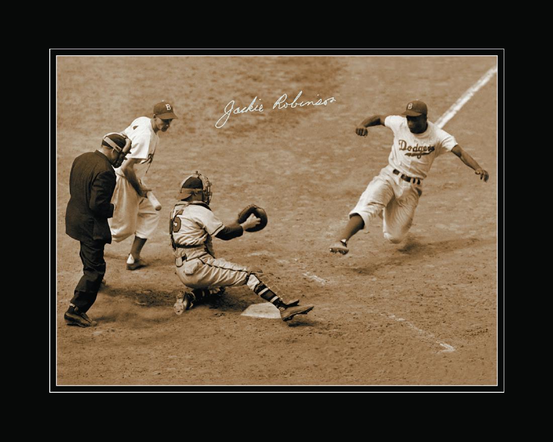 Jackie Robinson Archival Photo Facsimile Sig: A fuji crystal archival photo of Jackie Robinson Stealing Home. This original photo was taken on August 22, 1948 and features a facsimile signature of Jackie Robinson. Is presented in a black mat and