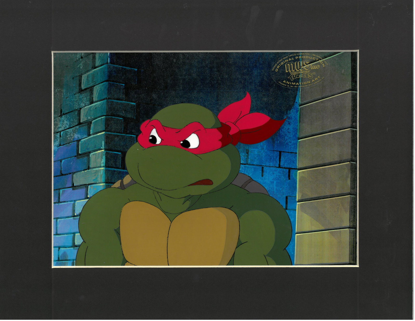A (TMNT) Turtles Production Cel with Raphael - MWS: A Teenage Mutant Ninja Turtle production cel. This cel depicts a frame from a scene in a Teenage Mutant Ninja Turtles cartoon episode featuring Raphael. TMNT was produced by Murakami-Wolf-Swenson Stud