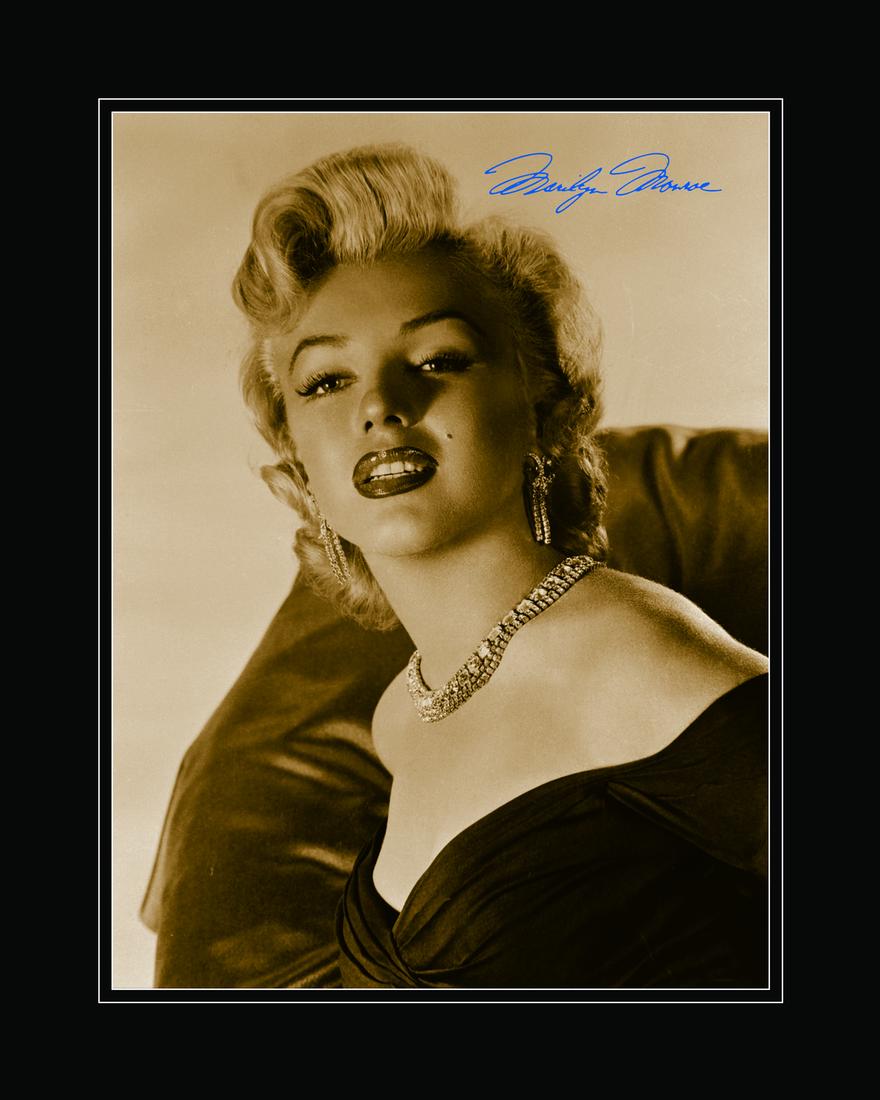 Marilyn Monroe Archival Photograph: An fuji crystal archival photograph entitled "Marilyn Monroe Portrait." This vintage photograph of Marilyn Monroe was taken on February 2, 1953. Features a facsimile signature and is presented matted.
