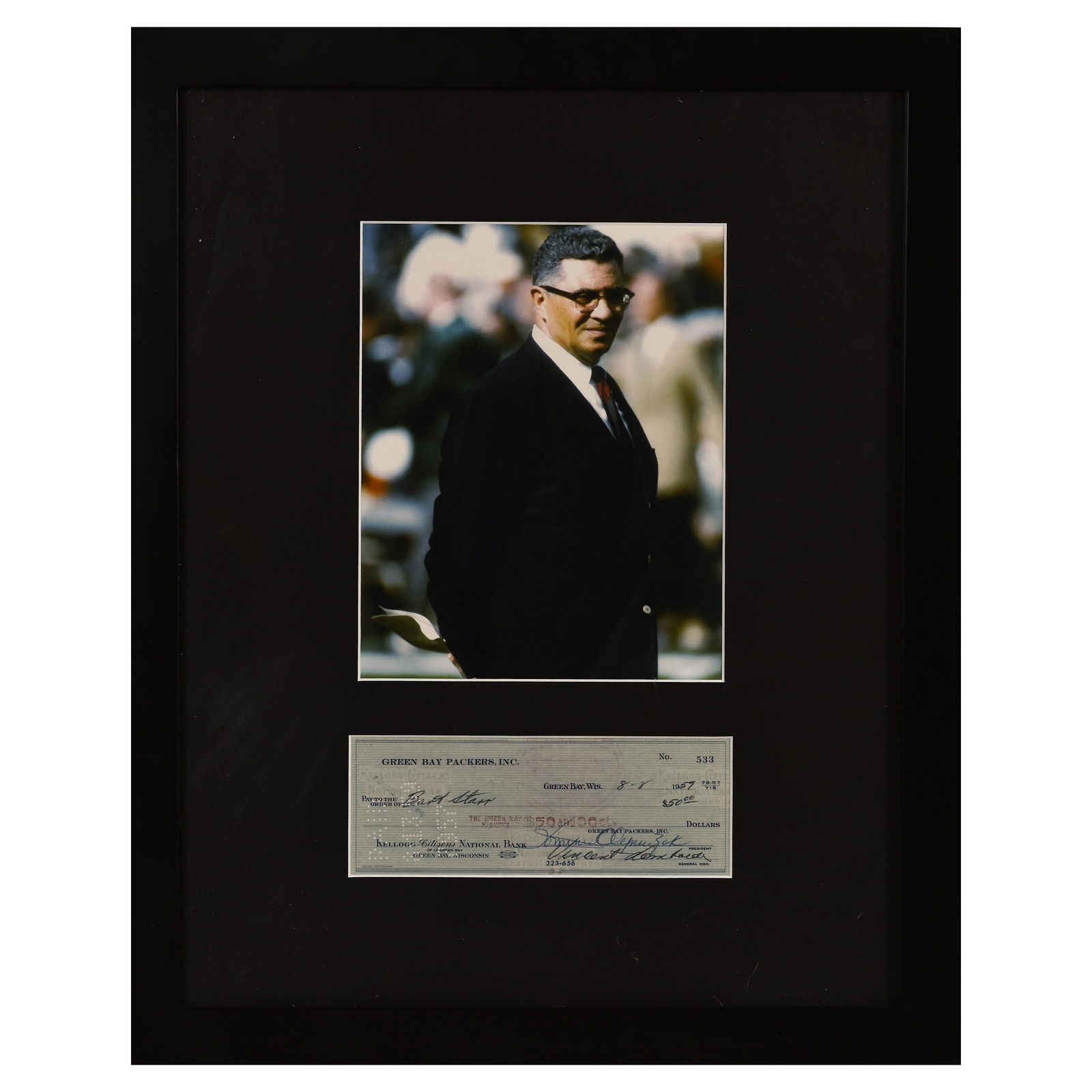 Vince Lombardi with Reproduction Check: An archival photograph entitled "Vince Lombardi." Lombardi is best known as the head coach of the Green Bay Packers during the 1960's. Includes a reproduction of a personal check signed by Vince Lomba