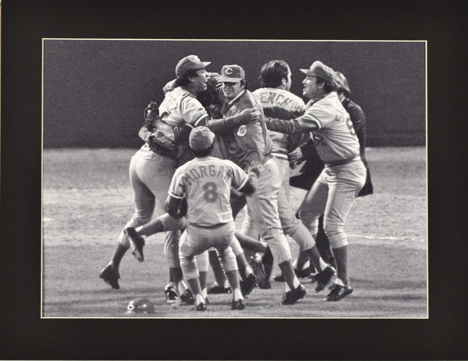 1975 Reds World Champs Celebration Fuji Crystal Photo: A fuji crystal archival photo of the Cincinnati Reds celebrating their 1975 World Champs victory. This photo was taken on October 23, 1975. Is presented in a black mat with a certificate of authentici