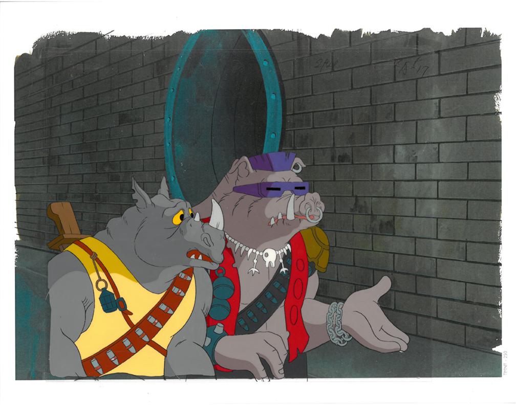 Rocksteady and Bebop of (TMNT) Turtles- Original: An original Teenage Mutant Ninja Turtle production cel. This cel depicts a frame from a scene in a Teenage Mutant Ninja Turtles cartoon episode. This frame features Rocksteady and Bebop . Is produced 