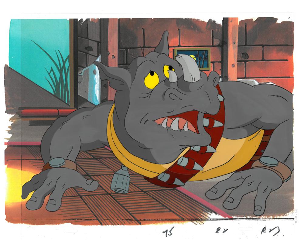 Rocksteady of (TMNT) Turtles- Original Production Cel: An original Teenage Mutant Ninja Turtle production cel. This cel depicts a frame from a scene in a Teenage Mutant Ninja Turtles cartoon episode. This frame features Rocksteady . Is produced by Murakam