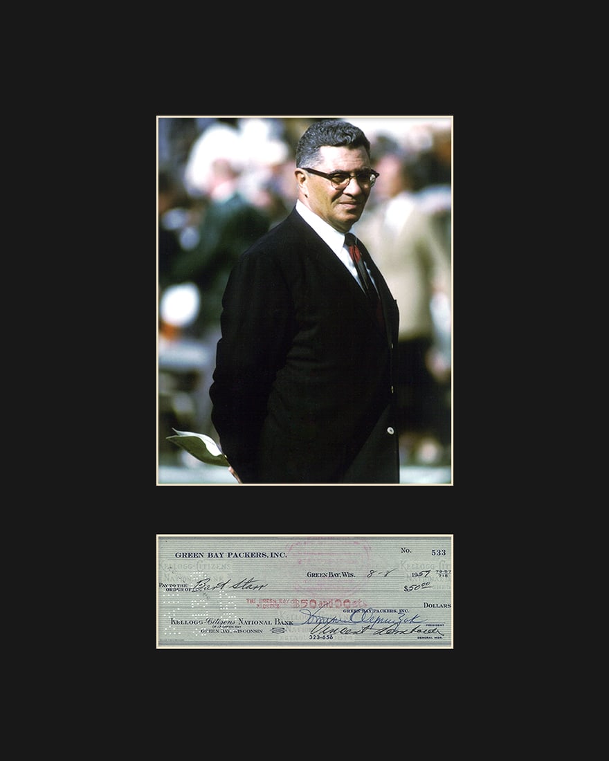 Vince Lombardi with Reproduction Check: An archival photograph entitled " Vince Lombardi ." Lombardi is best known as the head coach of the Green Bay Packers during the 1960's. Includes a reproduction of a personal check signed by Vince Lom