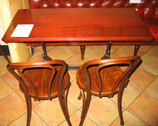 TABLE AND CHAIRS: Mahogany solid top dining table with cast iron base 1.2m x 600mm with 2 x spindle back wooden chairs
