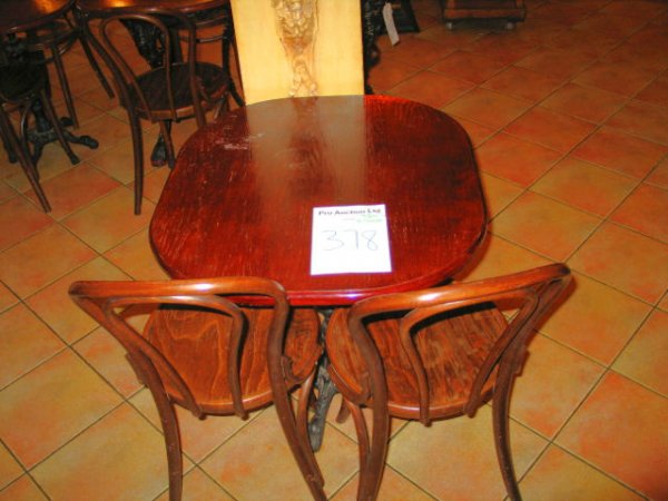 TABLE AND CHAIRS: Mahogany solid top dining table with cast iron base 780mm x 700 with 2 x spindle back wooden chairs
