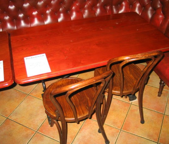 TABLE AND CHAIRS: Mahogany solid top dining table with cast iron base 1.2m x 680mm with 4 x spindle back wooden chairs