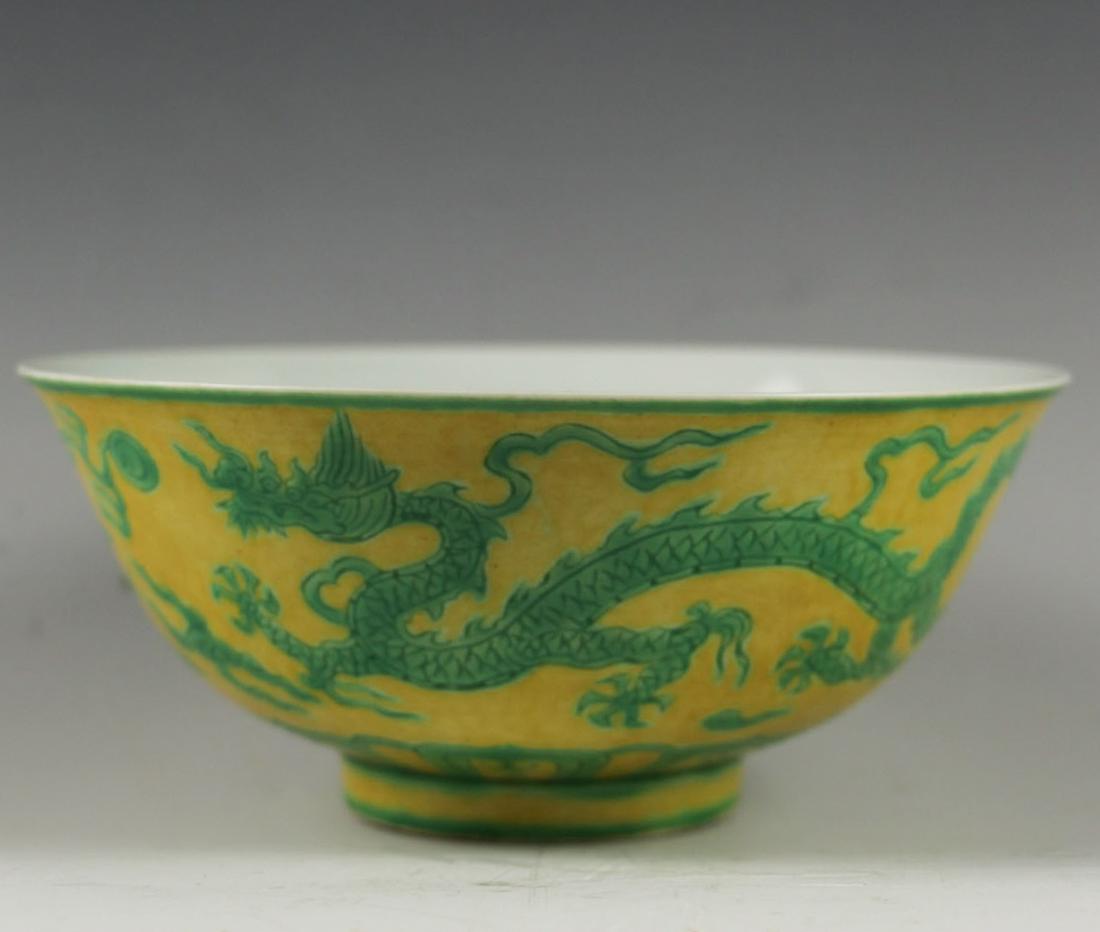 CHINESE YELLOW GROUND GREEN DRAGON PORCELAIN BOWL: Mouth diameter: 6.7 inches. Height: 2.8 inches. Mouth diameter: 17cm Height: 7cm. Provenance: From the collections of Mr. Ross from New York.