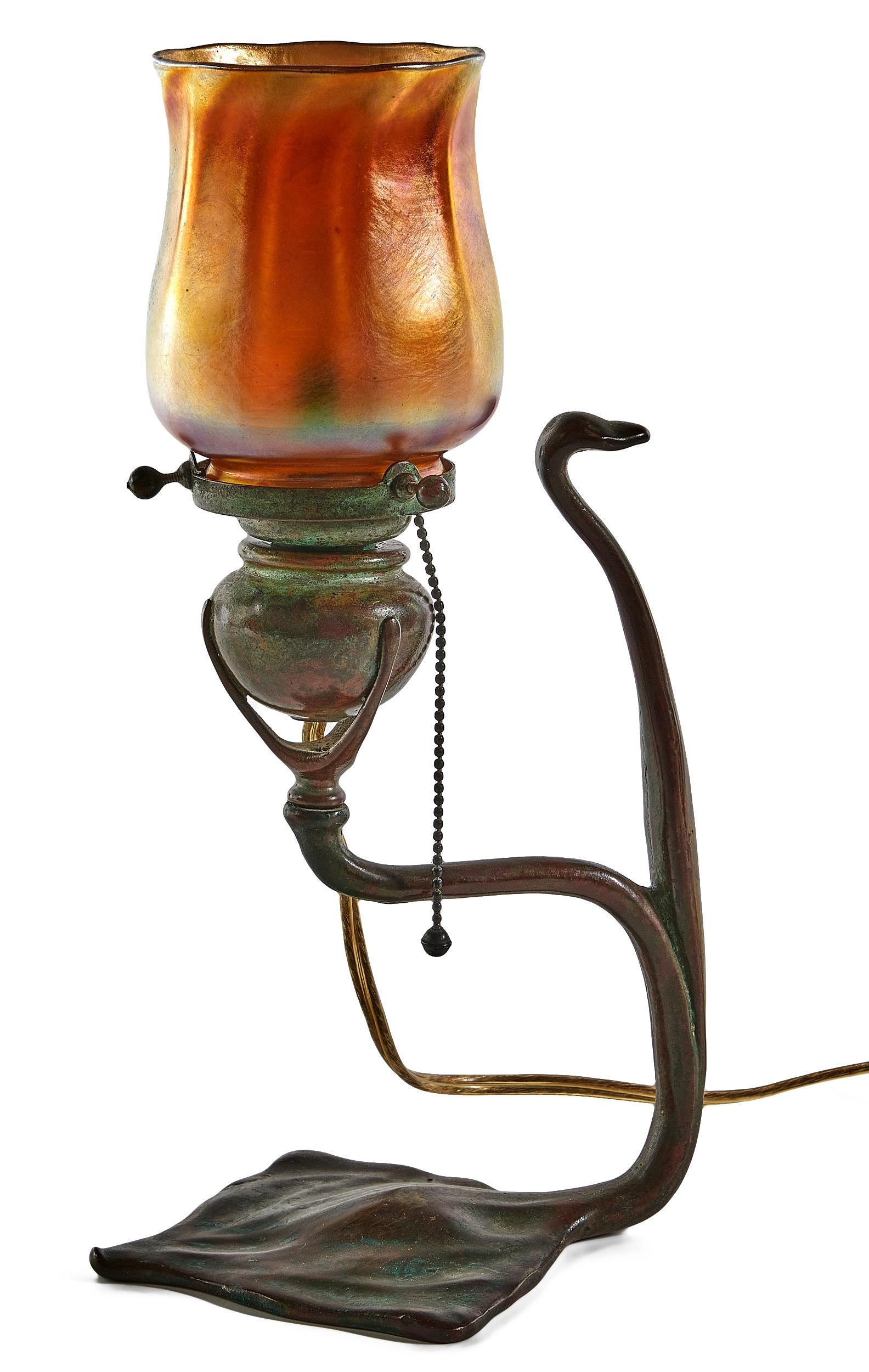 Tiffany Studios candlestick lamp: Tiffany Studios candlestick lamp New York, NY Favrile glass, bronze shade and base signed 12"h x 6"dia