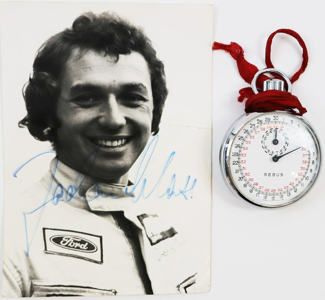 Autogramm Autographed driver card by Jochen Mass: With a stopwatch of the brand Rebus, on the back engraved 'Ford Jochen Mass', good condition