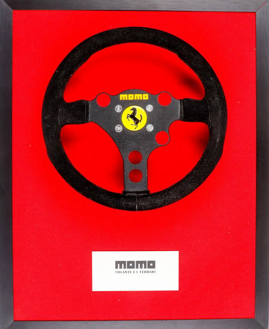 Ferrari MOMO F1 steering wheel for type Ferrari 412T2: Steering wheel was mounted on display, suitable for wall mounting, base plate covered with red fabric, 51 x 41 cm