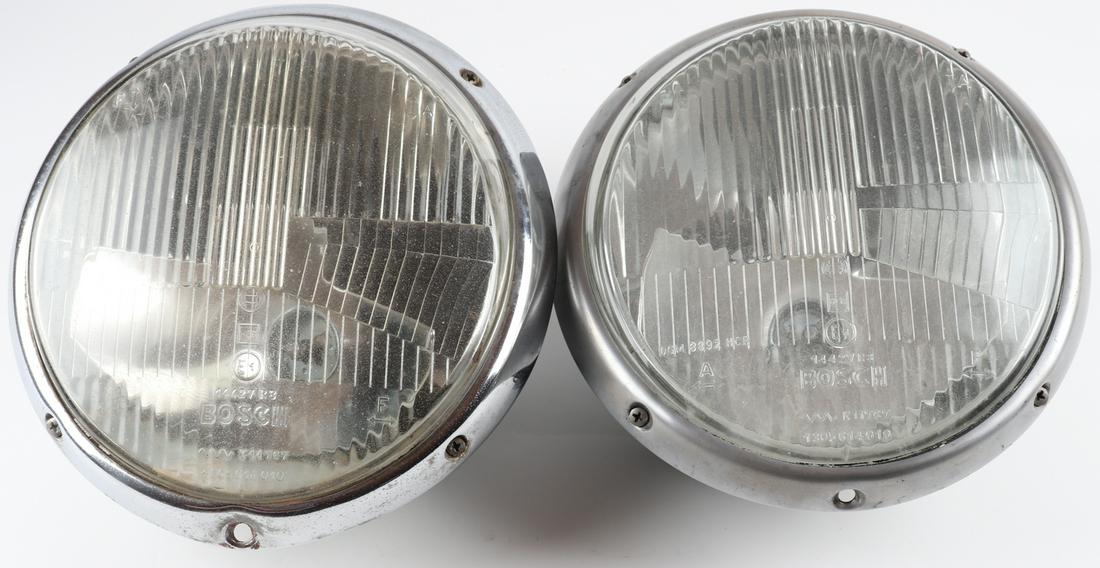 Porsche 2 main headlights for type 911 F-model: Manufacturer: Bosch 14427 R8, complete with case, glass and chrome bezel surrounds