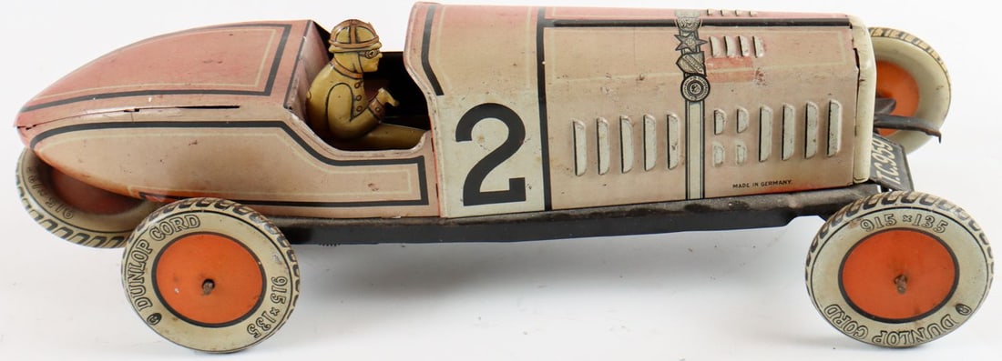 Automobilia Tin toy racing car from the Hertseller Tippco f: Germany, L: 37 x 12 x 13 cm, metal sheet, tin litho tire with the inscription 'Dunlop Balloon Cord 915 x 135', used, wind-up mechanism