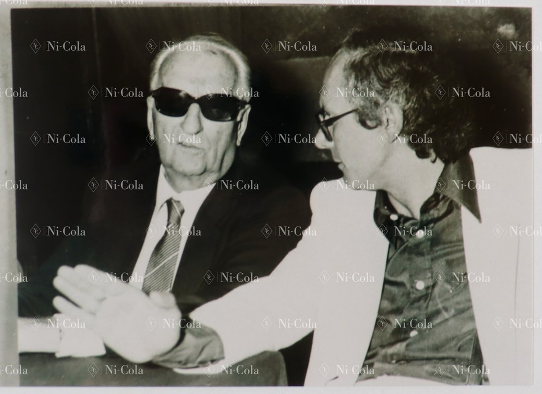 Ferrari Estate of the former racing director of Scuderia Fe: Original B/W negative and B/W press photo (new print) Enzo Ferrari and Nosetto in conversation at an event, early 1980s