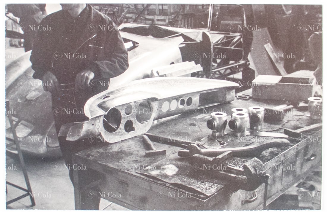 Ferrari Original B/W - Press photo restoration business in: In the foreground, a dashboard of a 250 GT SWB is being worked on, in the background the front of a 250 GTO can be seen, 18 x 13 cm, stamped: Foto Coltrin