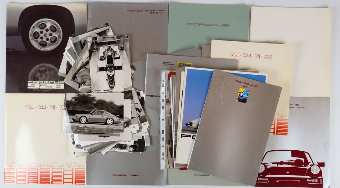 Porsche 76-piece brochures and original B&W press photos fr: Type 924, 944, 911, 928, 911 Turbo, 911 Carrera etc., predominantly German and French