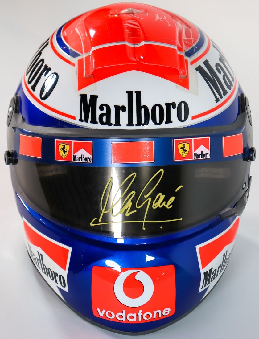 Ferrari Original F1 Schuberth Racing Helmet Signed by Marc: Full-size helmet (scale 1:1). In the iconic design of the Scuderia Ferrari from the team's most successful era of the 2000s. This helmet bears the authentic, handwritten signature of Marc Gene in gold