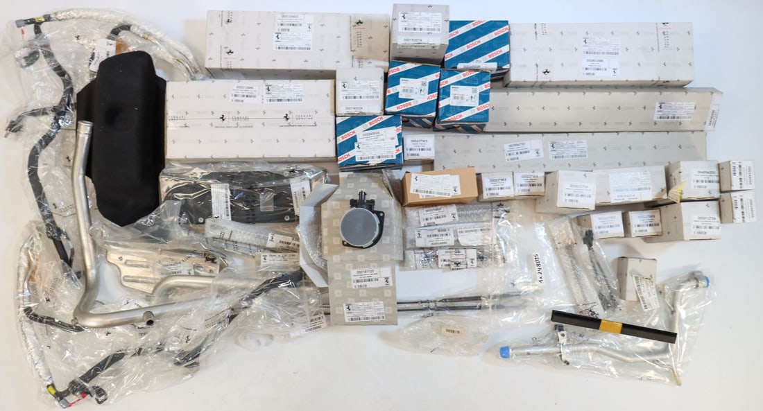 Ferrari 43-piece NOS spare parts for models from the 2000s: Part numbers: 325923, 312986, 182074, 917151, 808101, 938014, 245028, 912709, 252514 etc., each in original packaging