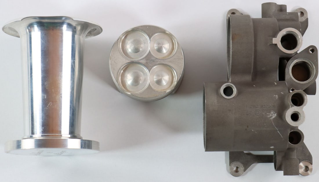 Automobilia 3-piece: Oil filter housing, F-2162 AS7G06, aluminum die-cast alloy, table display in the shape of an intake funnel, piston