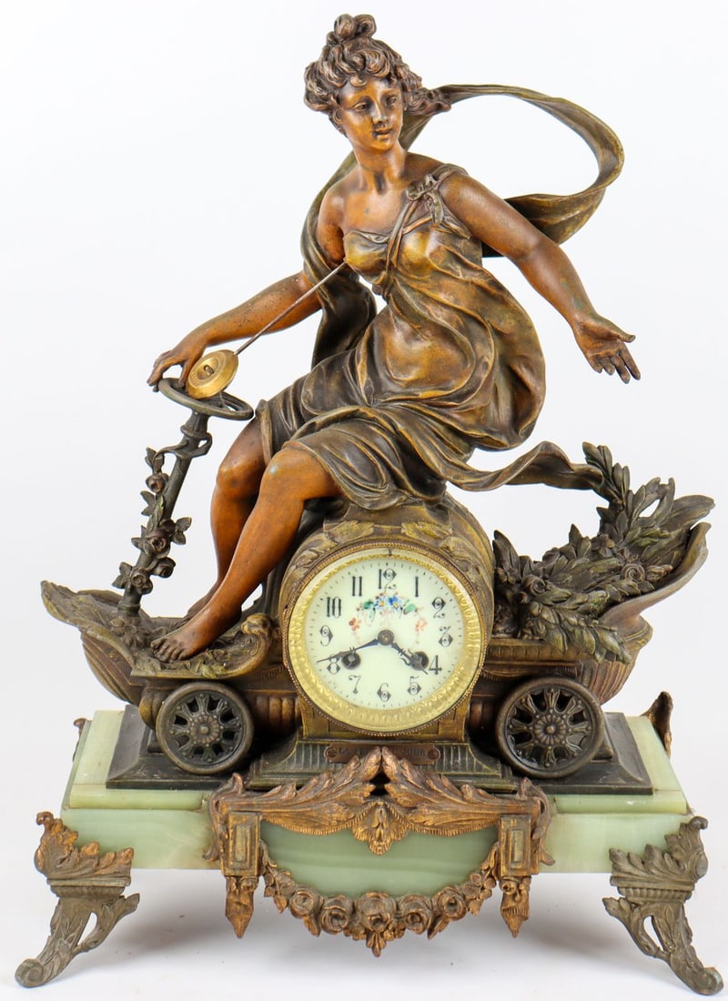 Automobilia Rare Mantel Clock 'La Reine du Jour Emilie Brou: S. Michel C4 Rue Royale Orleans, female motorist with garment flowing in the wind, dynamically depicted, seated on an automobile, tin-cast bronzed, on marble base, with golden applications, enameled