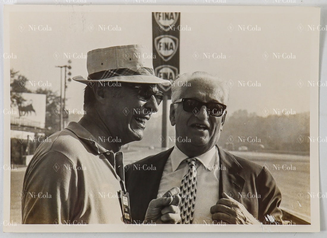 Ferrari Original B/W Press Photo Enzo Ferrari in Conversati: 12 x 16.7 cm, Enzo with his iconic sunglasses at the Monza racing circuit.