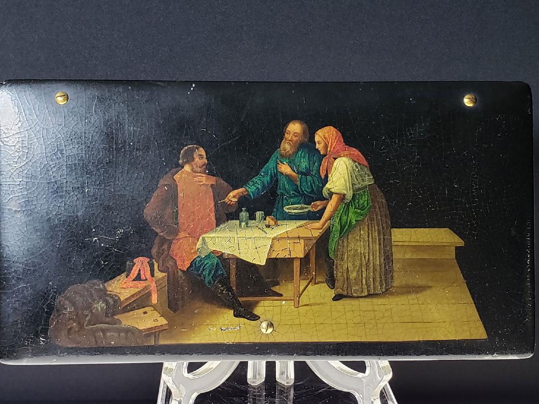 A fine Russian Lacquer Box , LUKUTIN: A FINE RUSSIAN LACQUERWARE LIDDED BOX, LUKUTIN, CIRCA 1890. The hinged lid is painted with a decorated old interior scene. ( a Lukutin trademark) and the interior in red lacquer with Lukutin factory m