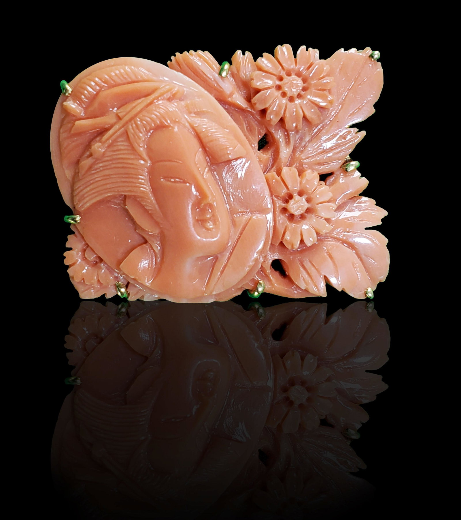 A Finely Carved Tahitian Coral Pendant 11 Grams: A Finely Carved Tahitian Coral Pendant . Measures 1 1/4" x 1"