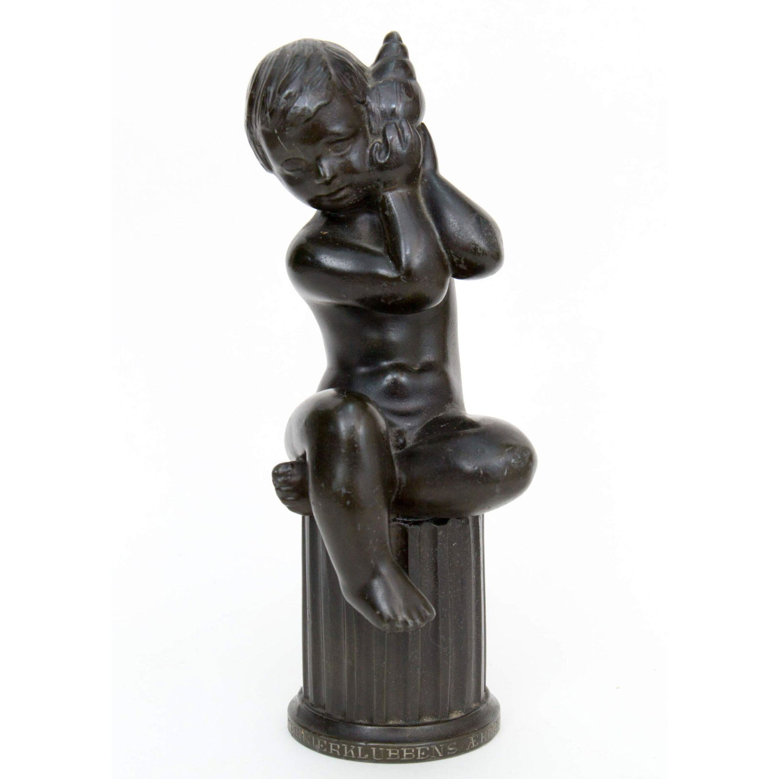 Old Just Andersen Diskometal Boy w/ Conch Shell Sculpt: Antique Just Andersen Diskometal Boy w/ Conch Shell SculptureMeasures 7” H x 2 1/2” W x 3” D. Danish. Signed JUST 2355. Bronze over Diskometal. Just Andersen (1884-1943).