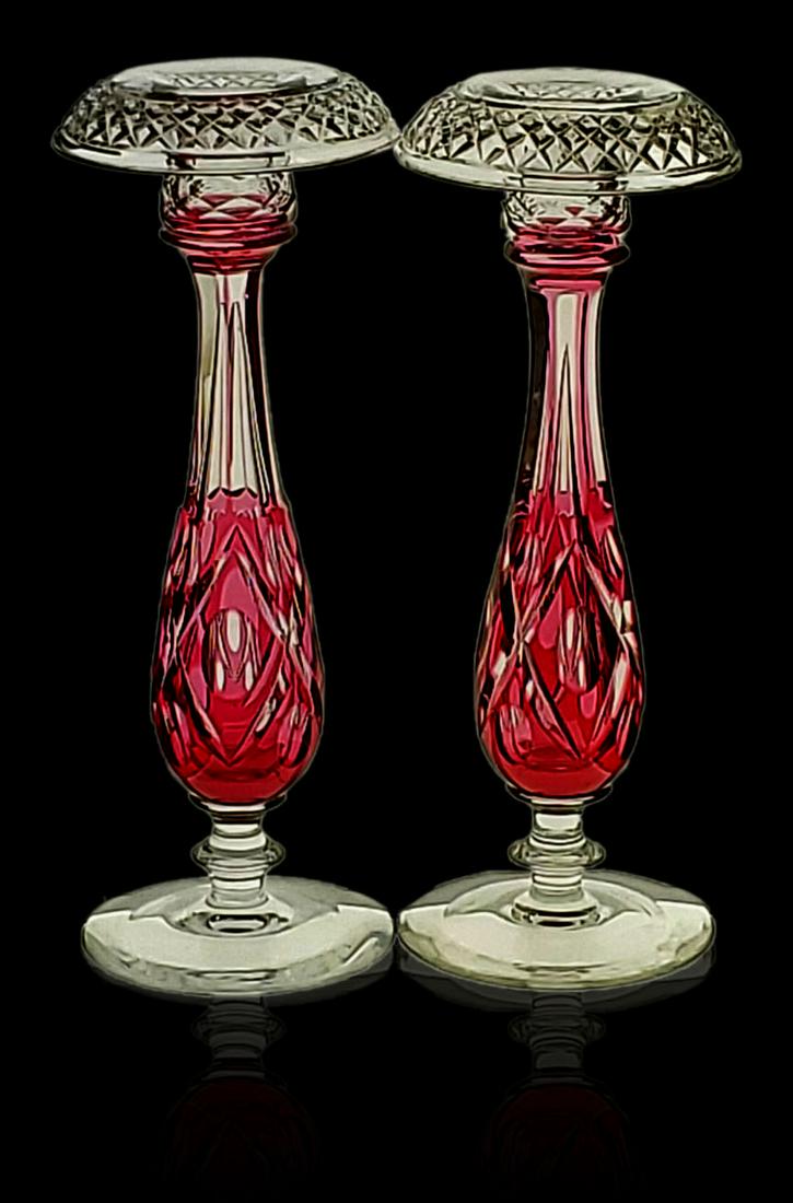 Pairpoint cranberry cut to clear candlesticks ADELAIDE: Pr of Pairpoint cranberry cut to clear cut glass candlesticks ADELAIDE. Measures 11 3/4" Tall