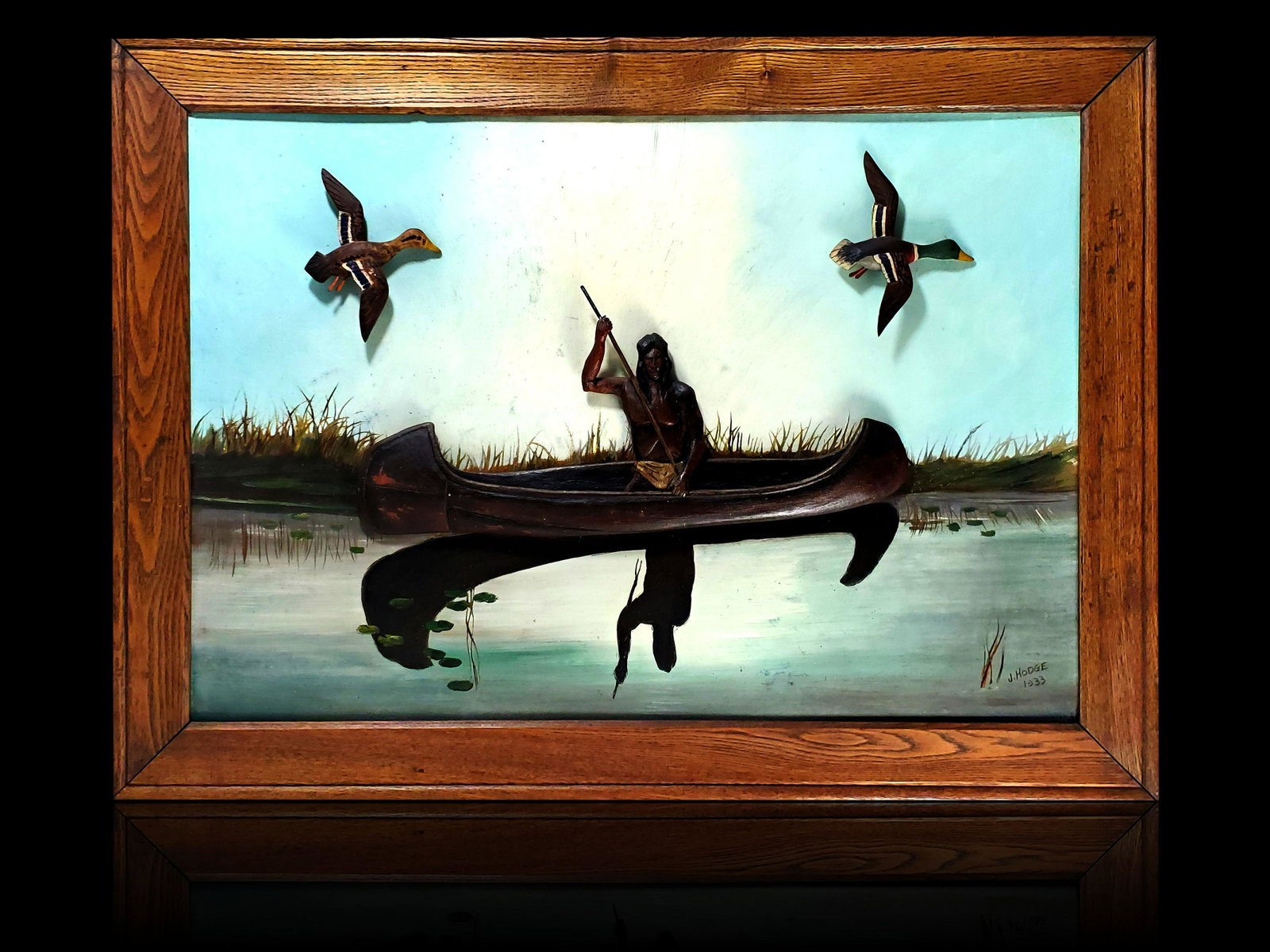 J Hodge 1933 folk art painting carved Indian & ducks: J. HODGE, (American, 20th Century) AMERICAN FOLK ART BAS RELIEF PAINTING. Frame measures 23 3/4" x 32 1/4"