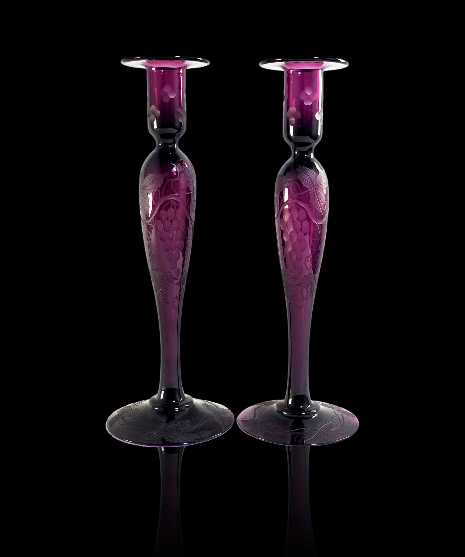 Pair of Pairpoint candle holders amethyst grape pattern: Pair of Pairpoint candle holders amethyst grape pattern. Measures 12" tall.