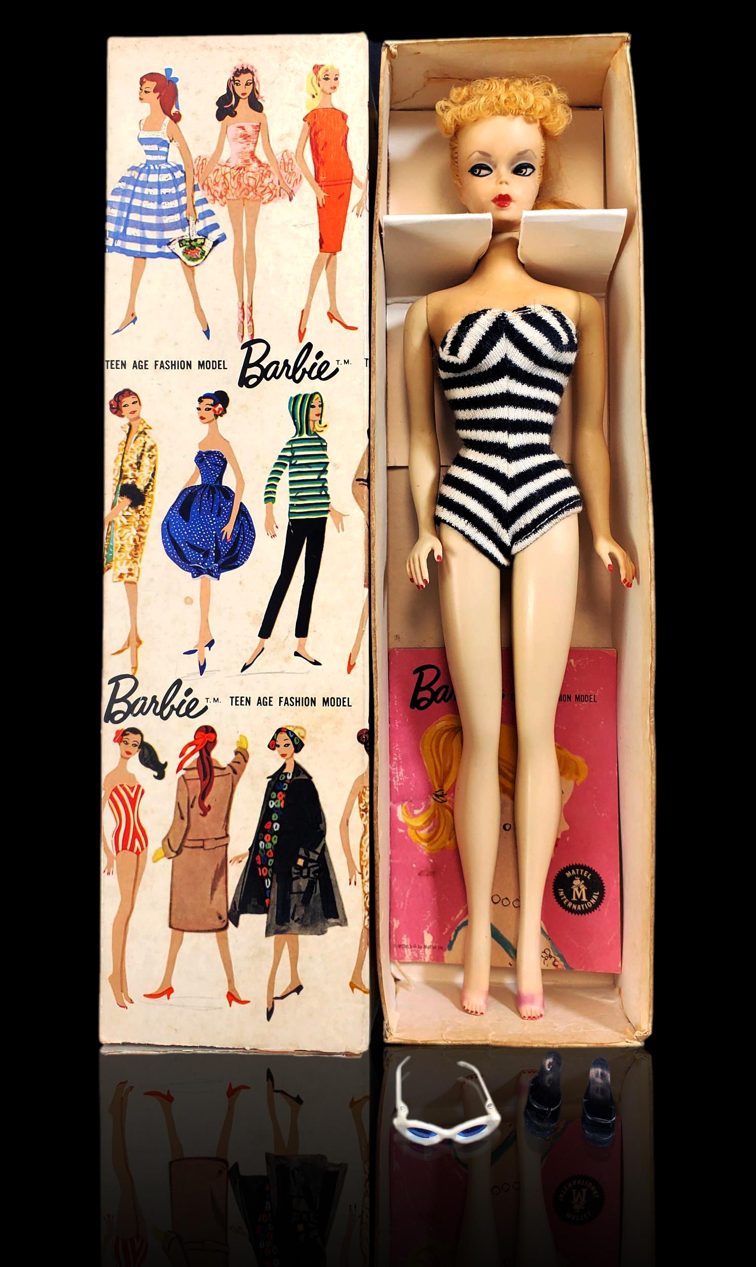 Original #1 Blonde Barbie doll w/ accessories: Original #1 Blonde Barbie doll w/ accessories White Irises with arched Brows. All original face paint with minimal play wear. Ponytail complete with original Rubber bands visible and full Curly bangs 