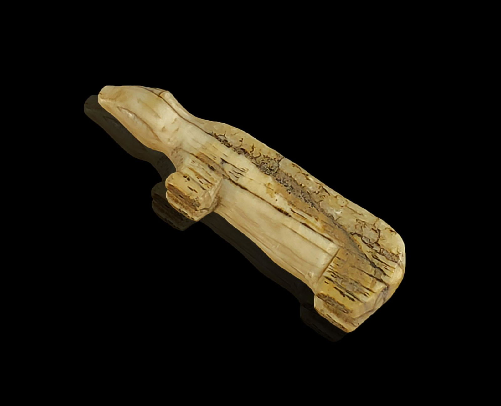 A pre historic inuit bear token: A pre historic Inuit bear token. Measures 2 3/4" x 1/2" x 1/2"