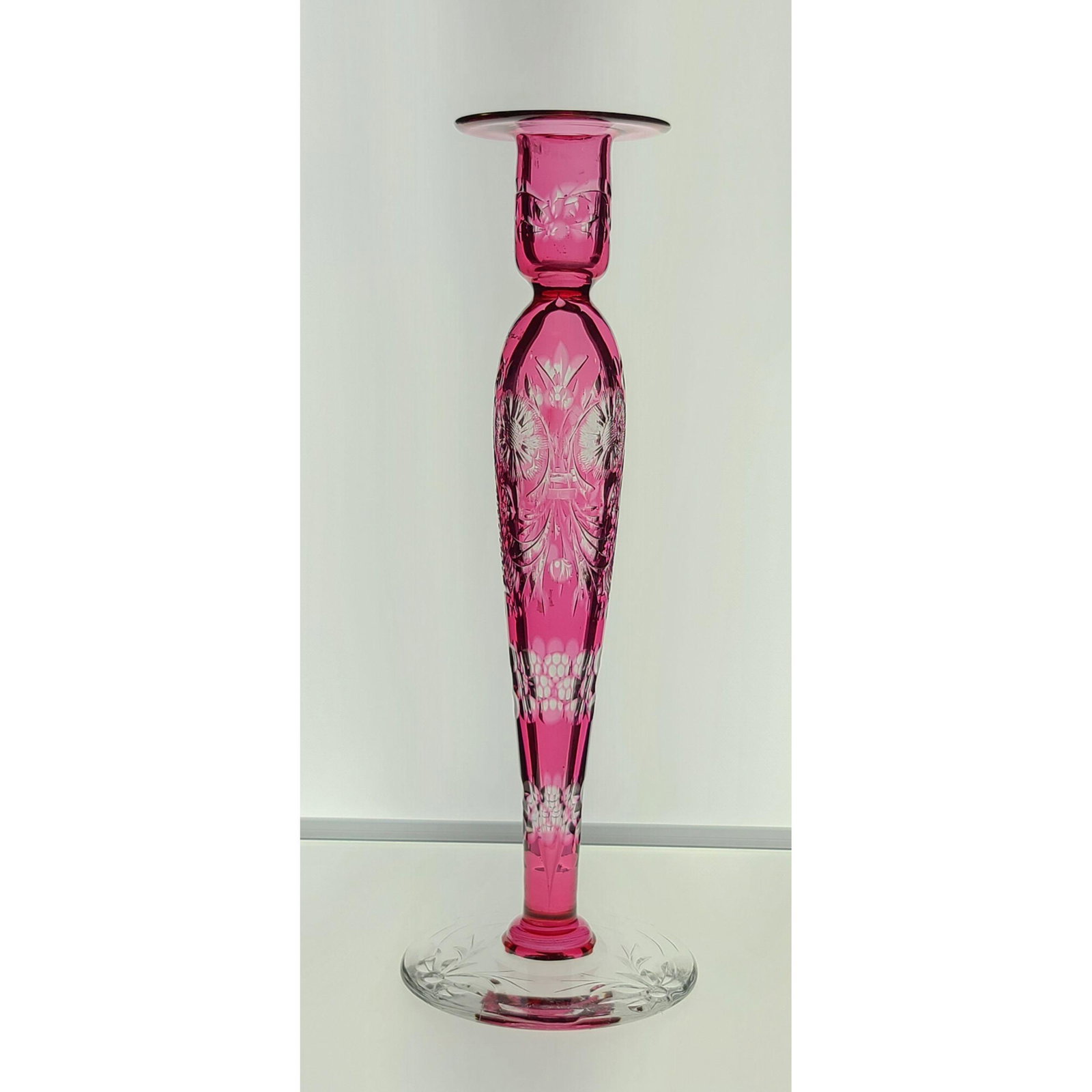 ABP cut glass cranberry cut to clear candlestick rock..: ABP cut glass cranberry cut to clear candlestick, rock crystal engraving, signed LIBBEY. Measures 10 3/4" t